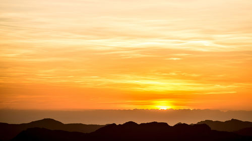 Scenic view of dramatic sky during sunset