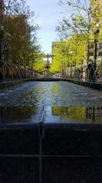 Scenic view of bridge in city against sky