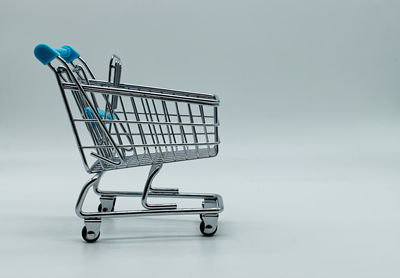 Side view of a metallic structure against white background