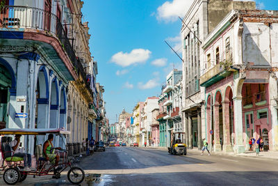 People walking on street in city