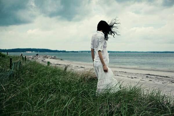 sky, rear view, full length, sea, beach, water, horizon over water, grass, standing, cloud - sky, casual clothing, leisure activity, tranquility, tranquil scene, lifestyles, shore, nature, cloud