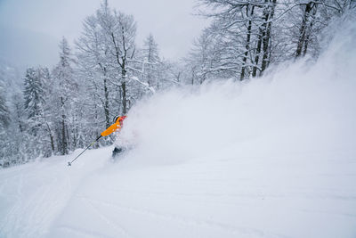 Man skiing on snowcapped mountain