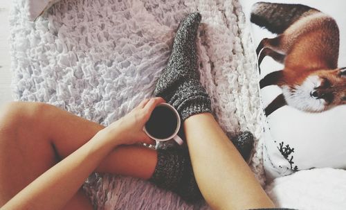 Close-up of woman standing on tiled floor