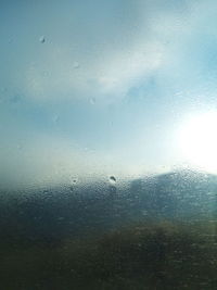 Full frame shot of raindrops on glass window