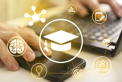 High angle view of hand on illuminated table