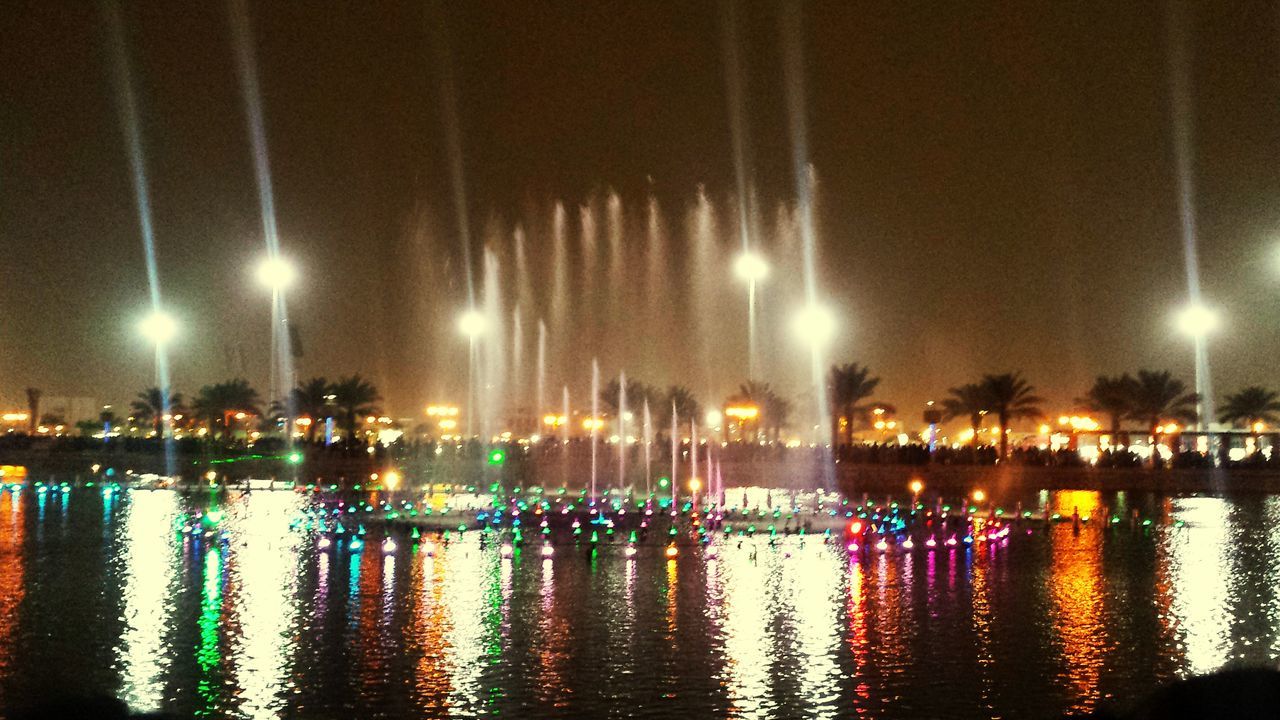 water, illuminated, reflection, night, waterfront, nautical vessel, lake, boat, transportation, river, city, mode of transport, lighting equipment, rippled, no people, outdoors, sky, building exterior, moored, street light