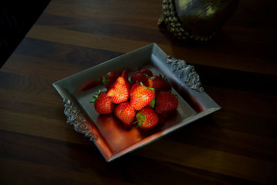 High angle view of strawberries on table