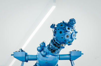 Low angle view of blue umbrella