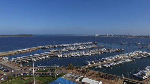 High angle view of harbor against clear blue sky