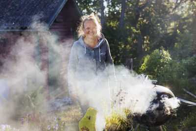 Woman having barbecue