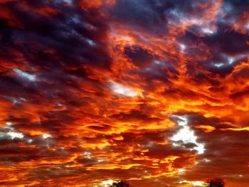 Low angle view of dramatic sky during sunset