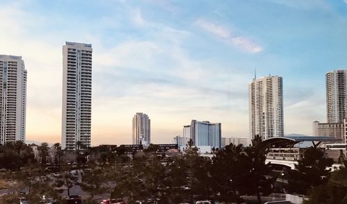 Modern buildings in city against sky