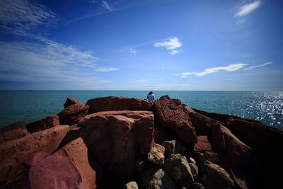 Scenic view of sea against blue sky