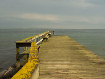 Pier over sea against sky