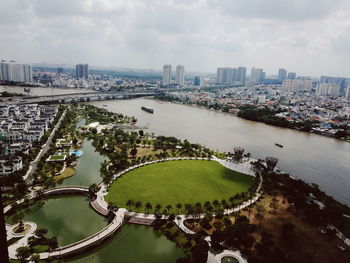 High angle view of river amidst buildings in city