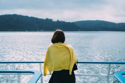 Rear view of woman looking at sea