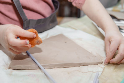 Midsection of man preparing food