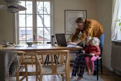 Father with daughters at table