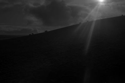 Scenic view of silhouette landscape against sky at dusk