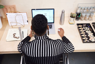 High angle view of businesswoman working at office