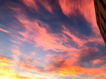 Low angle view of dramatic sky during sunset