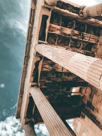 Low angle view of abandoned building against sky