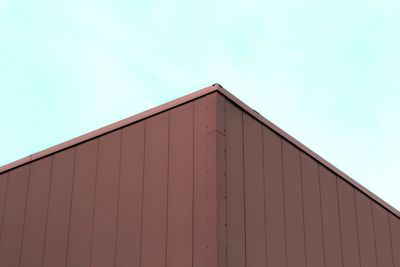 Low angle view of warehouse against sky