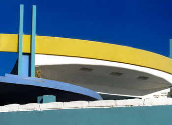 Yellow boat against clear blue sky