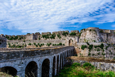 Old ruin building against cloudy sky