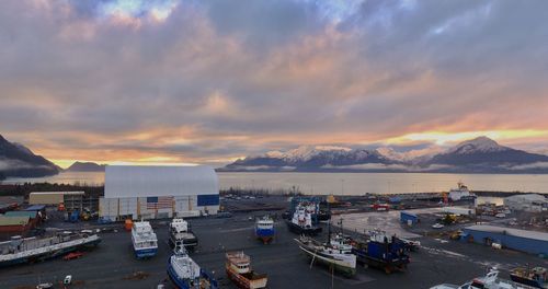 High angle view of harbor against sky during sunset