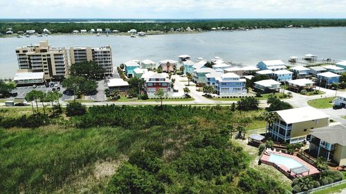 High angle view of buildings and sea in city