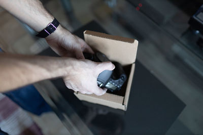 Midsection of man using mobile phone