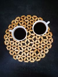 High angle view of coffee cups on table