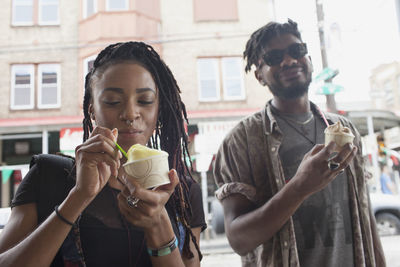 Young couple holding ice cream
