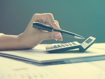 Midsection of person holding mobile phone