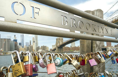 Close-up of padlocks hanging on railing