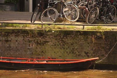 Bicycles parked against water