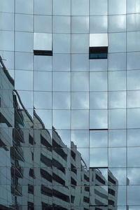 Open windows in an modern glass building with reflection