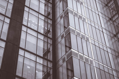 Low angle view of glass building in city