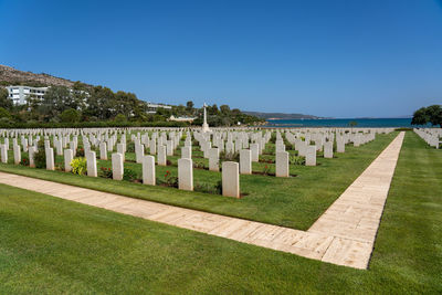 View of cemetery against clear blue sky