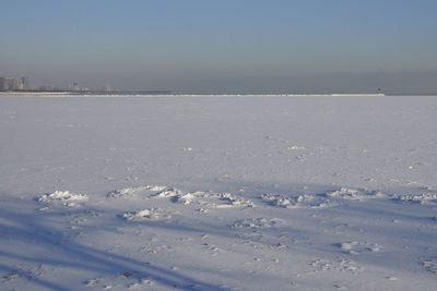 Scenic view of sea against sky during winter