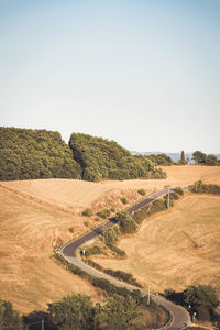 Scenic view of agricultural field against clear sky