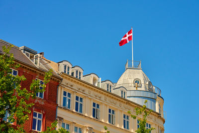 Low angle view of building against clear blue sky