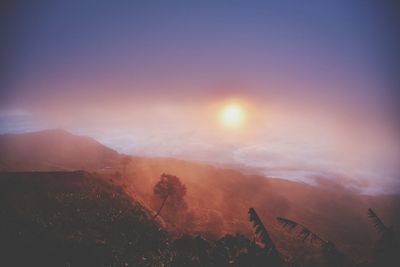 Scenic view of mountains against sky during sunset