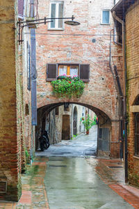 Alley amidst buildings in city