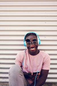 Portrait of young man using smart phone