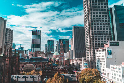 Modern buildings in city against sky