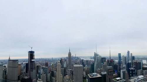 Modern buildings in city against sky