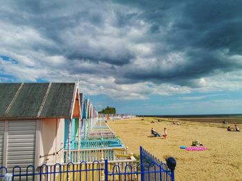 Panoramic view of buildings against cloudy sky