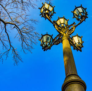 Low angle view of statue against clear blue sky